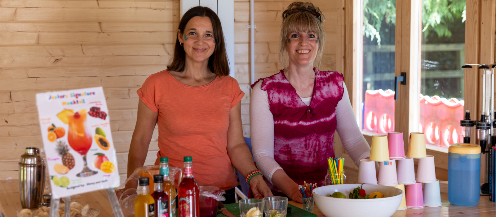 two volunteers smiling at the jacks cabin