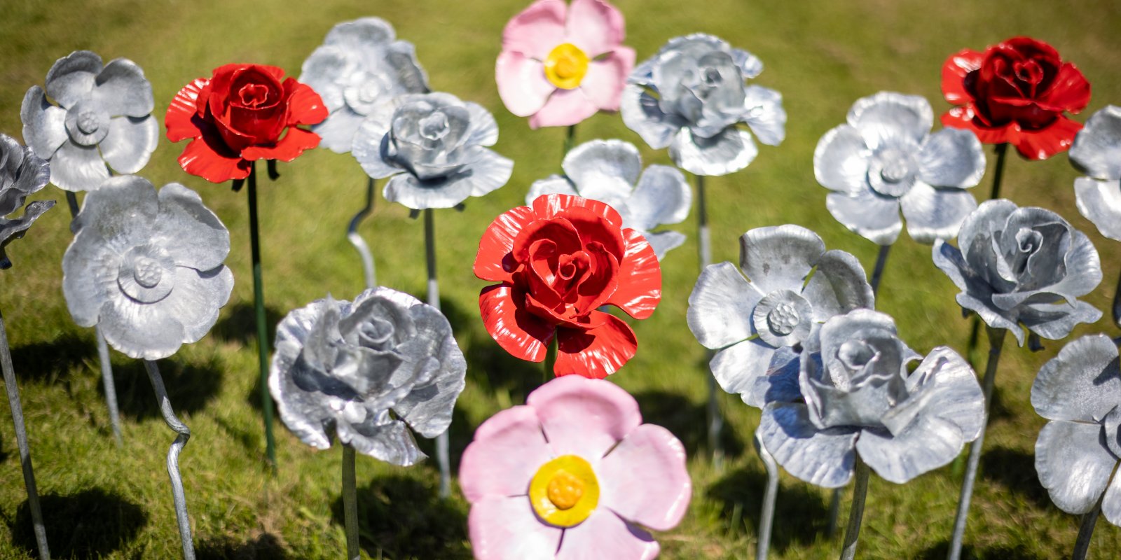 A range of beautiful handcrafted metal roses,both painted and unpainted